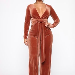 Rust colored velvet jumpsuit from Fashion Nova!